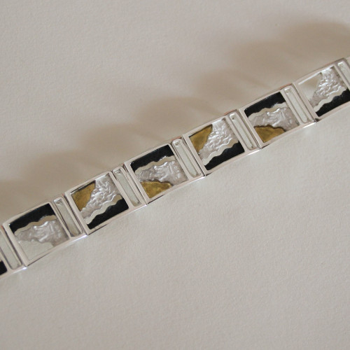 1683 - SILVER & GOLD BRACELET. B1683